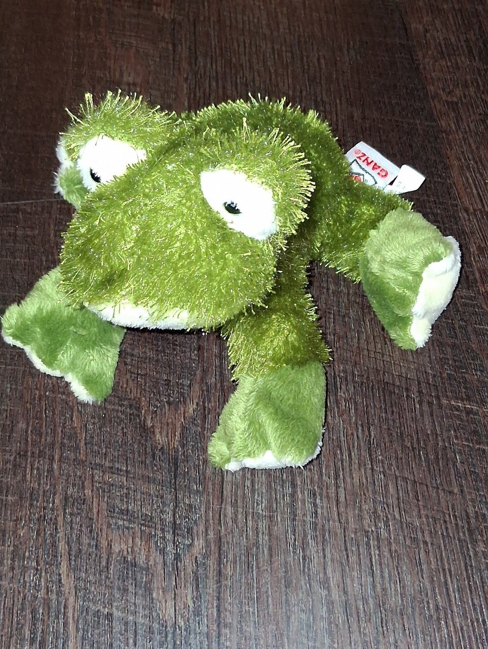 Ganz Webkinz plush frog featuring bright green fuzzy fur and white plush paws.